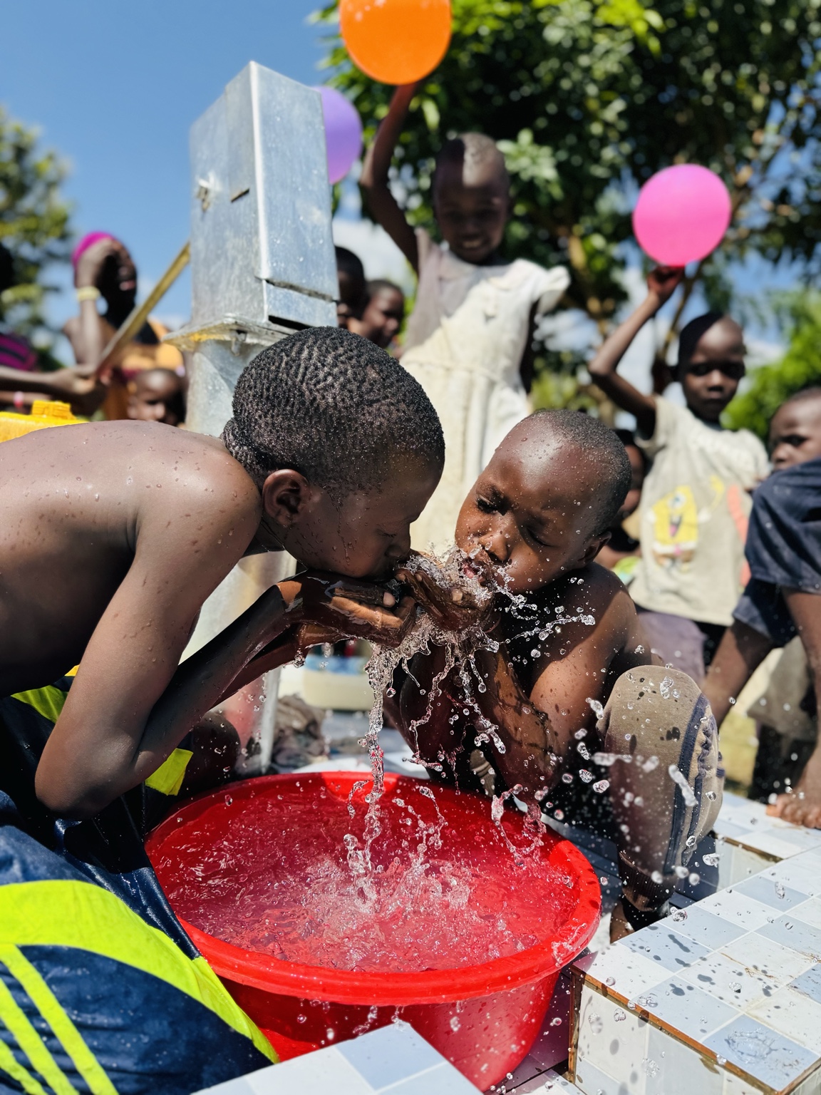 Children enjoying clean water